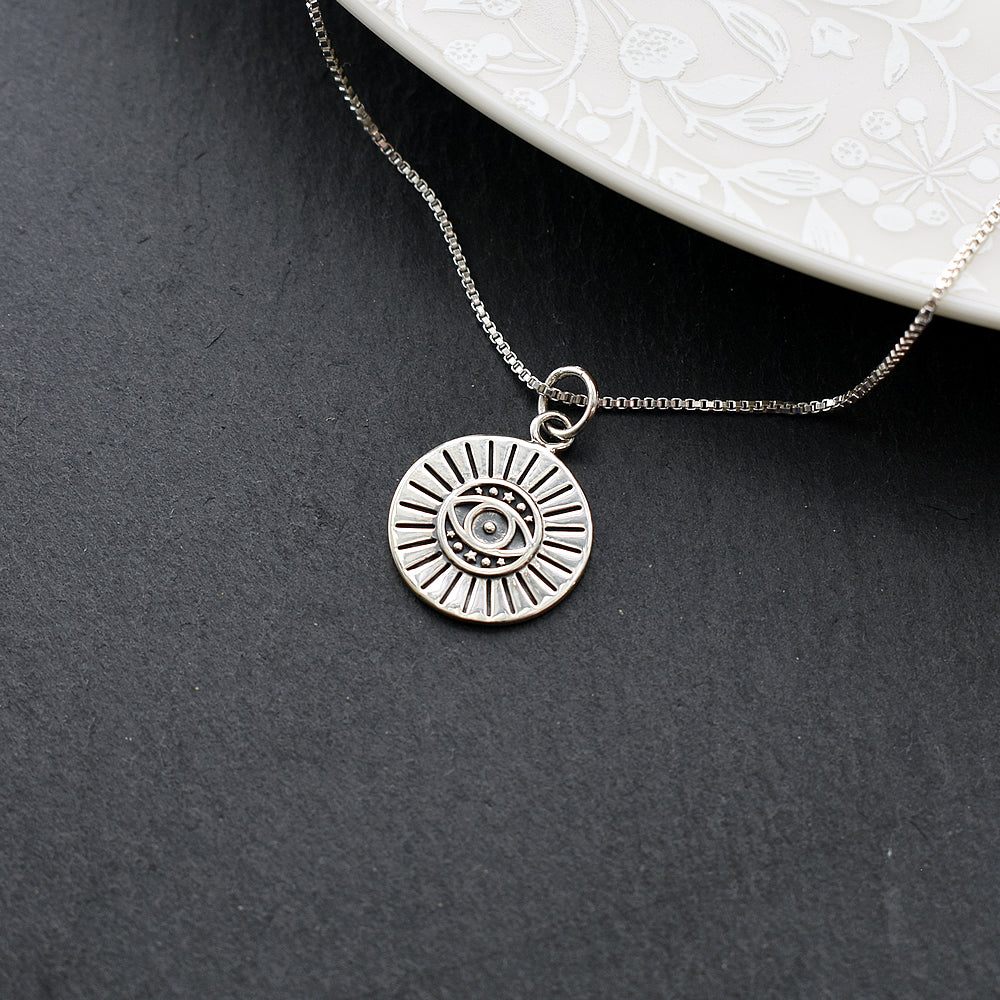 Zora disc evil eye pendant