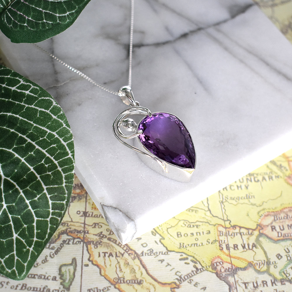 Teardrop amethyst facet pendant with wire detail