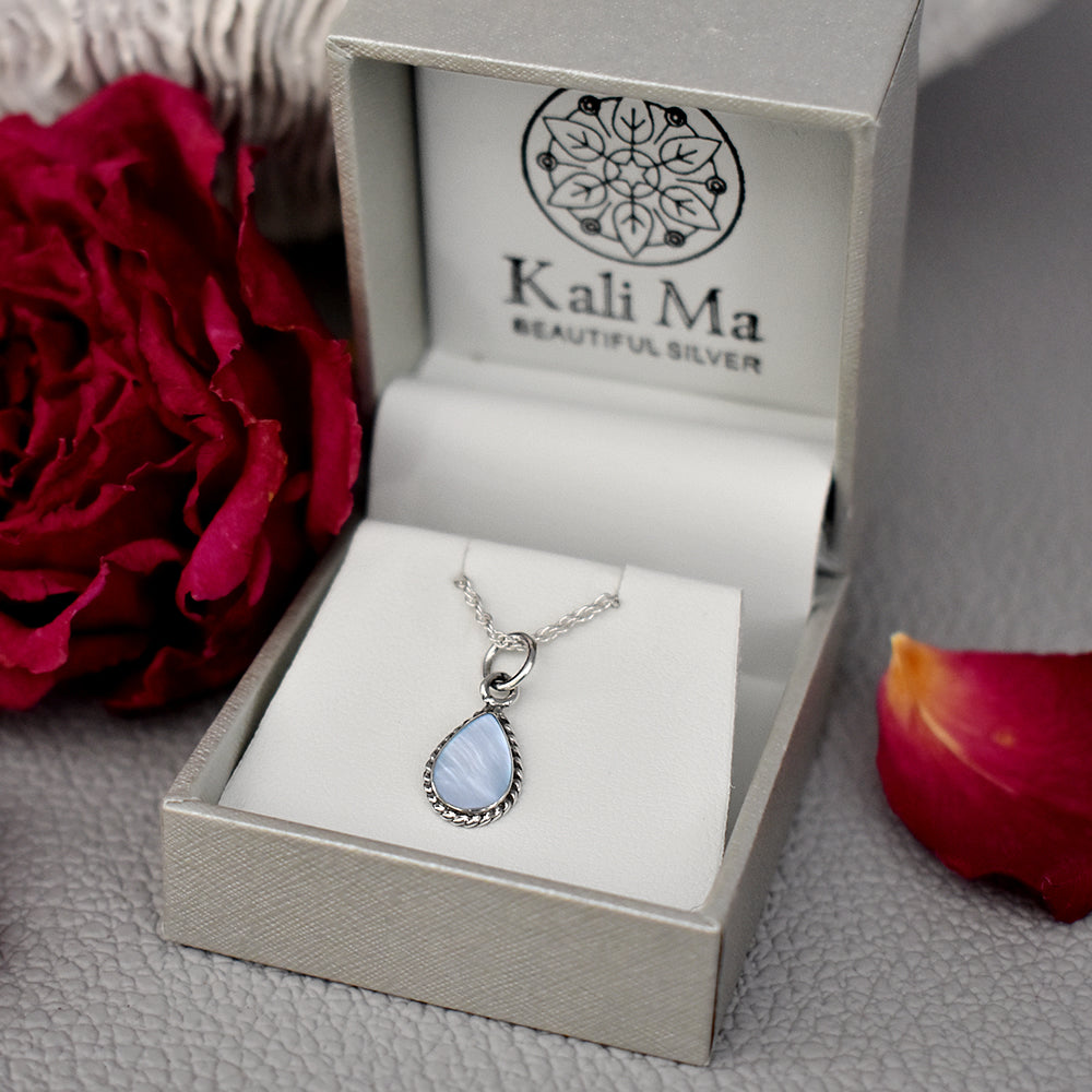 Smile oxidised teardrop pendant with blue mother of pearl
