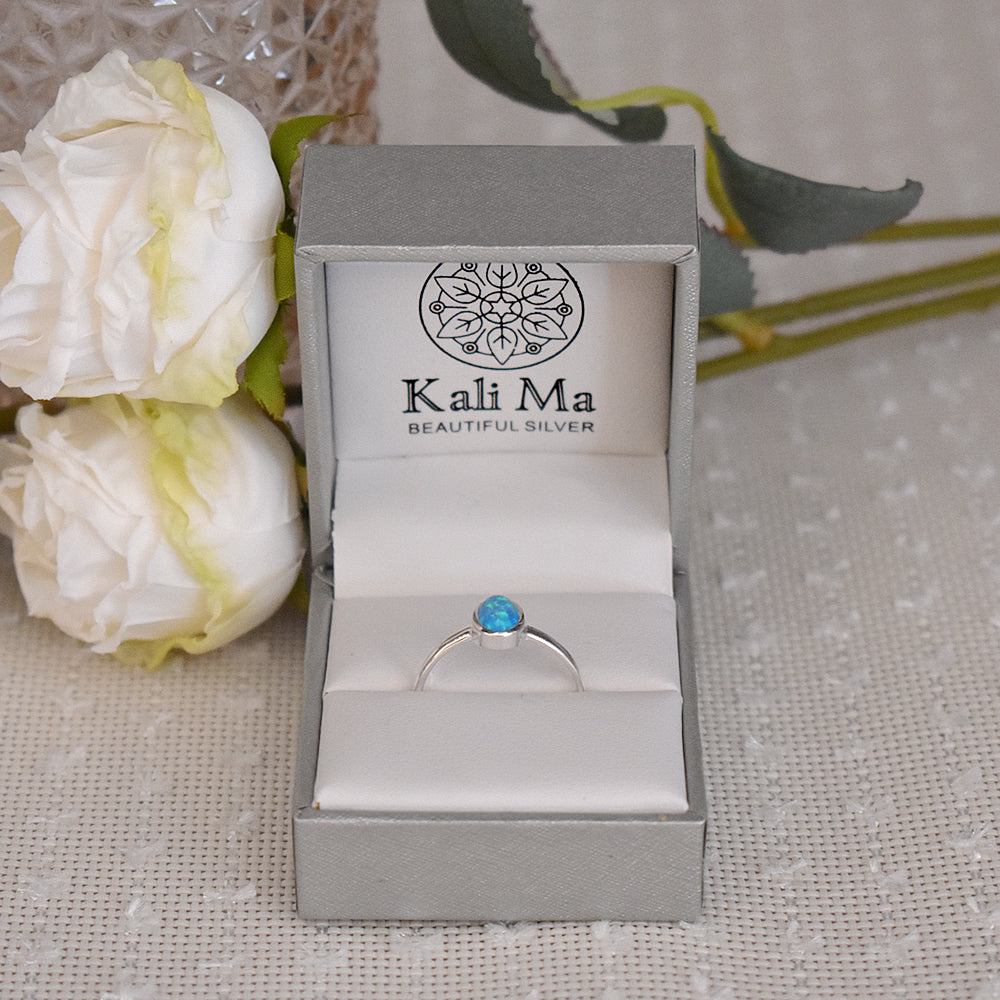 Angelica oval blue opalique plain shank ring