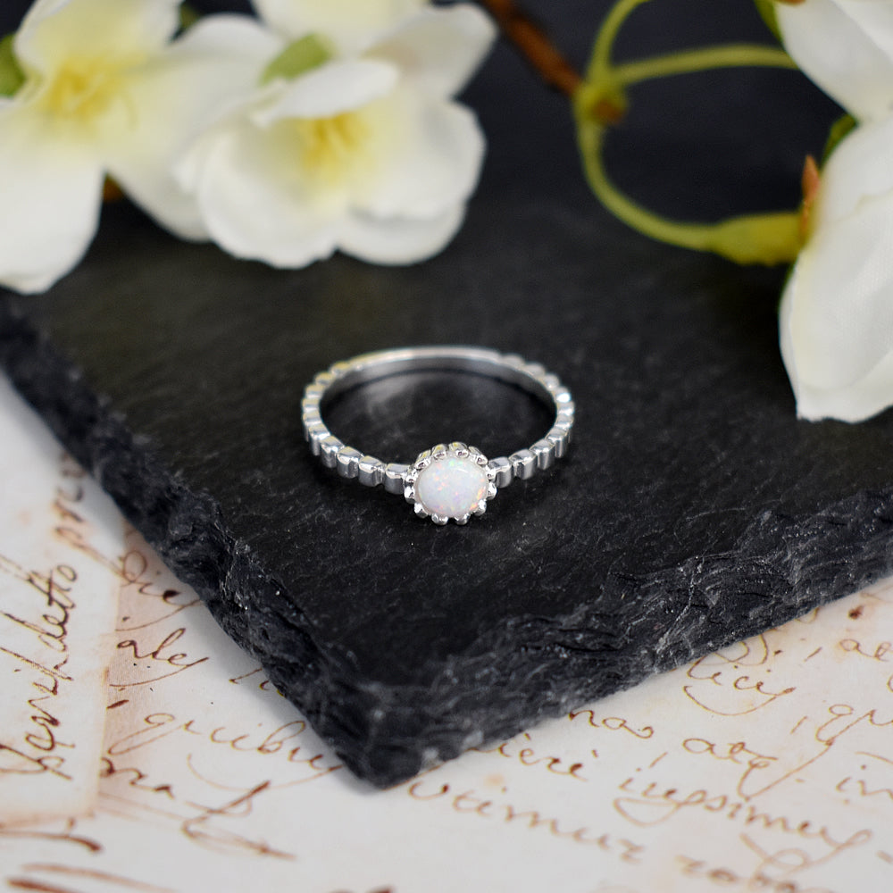 Bethan crimped band with round white opalique ring