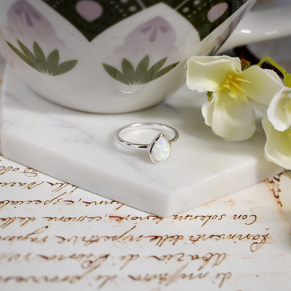 Angelica teardrop white opalique fine band ring