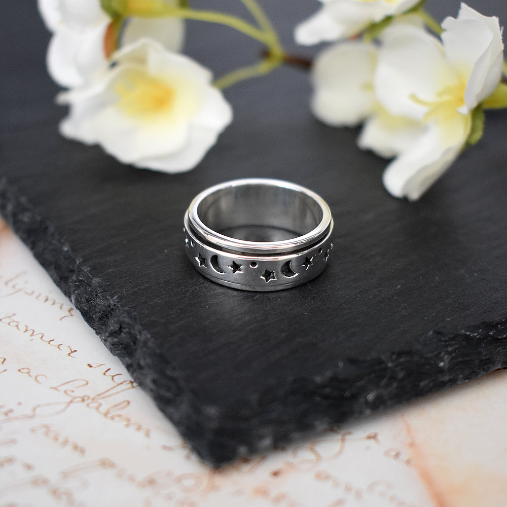 Dahna spinning band with cut out moons & stars ring