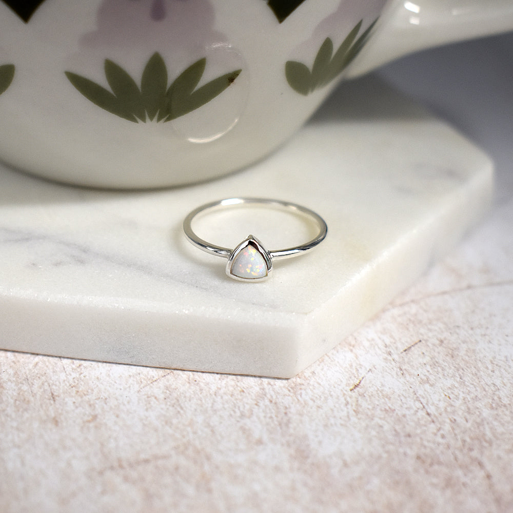 Angelica trillion-cut white opalique ring