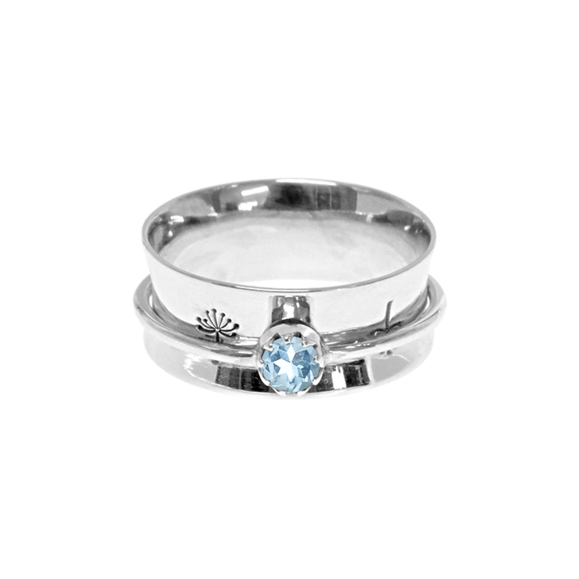 Catalina dandelion etched spinner ring with blue topaz