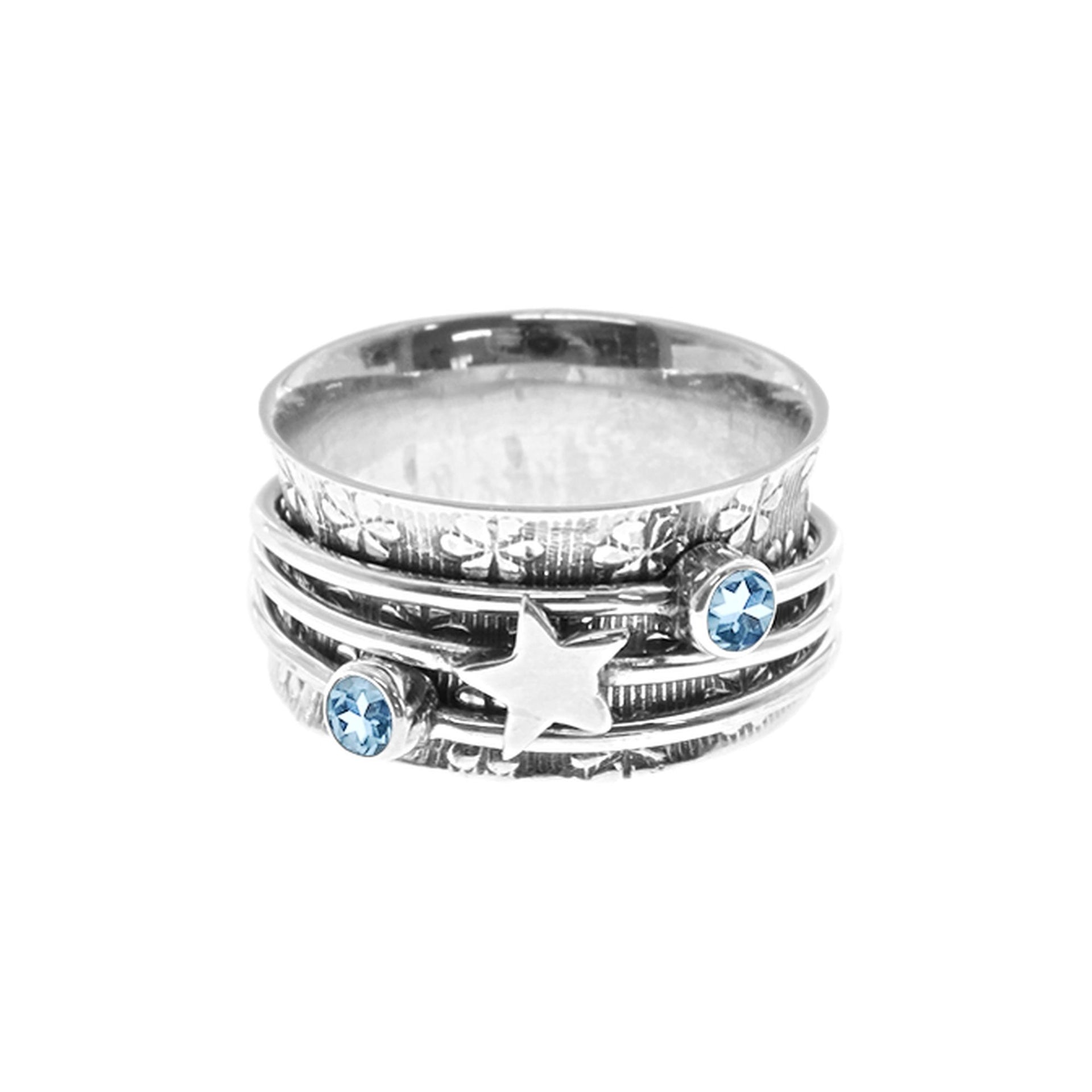 Catalina triple spinner ring with star and blue topaz