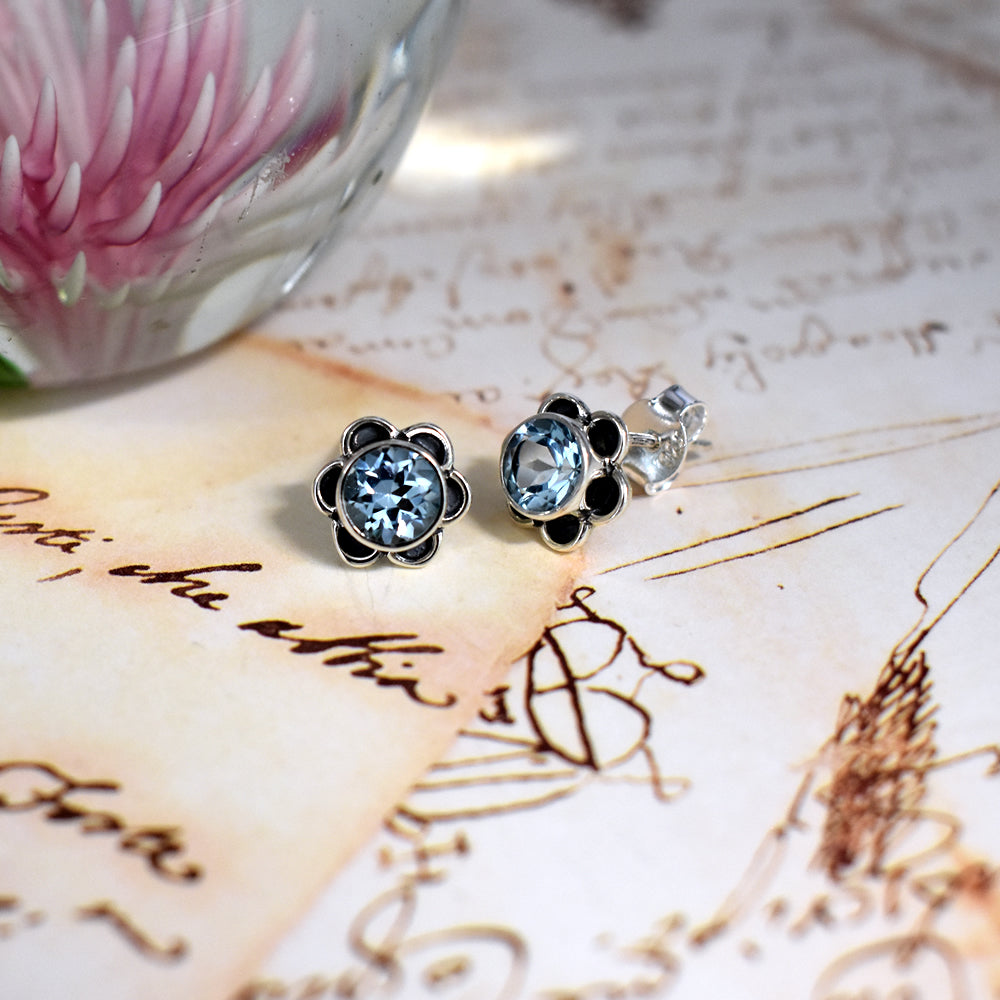 Catalina flower studs with blue topaz centre