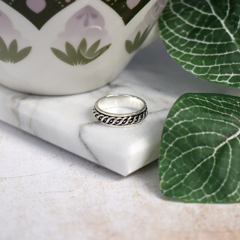 Harley ring with ornately detailed spinning band